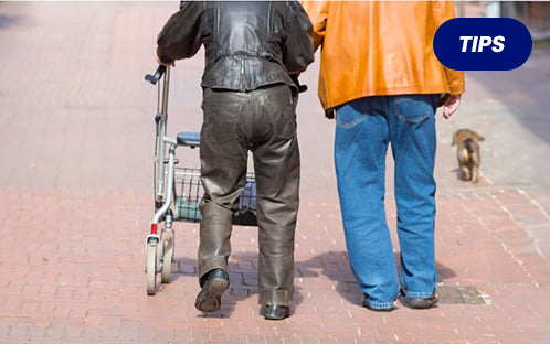Seniors with a 4 wheel rollator walker outside