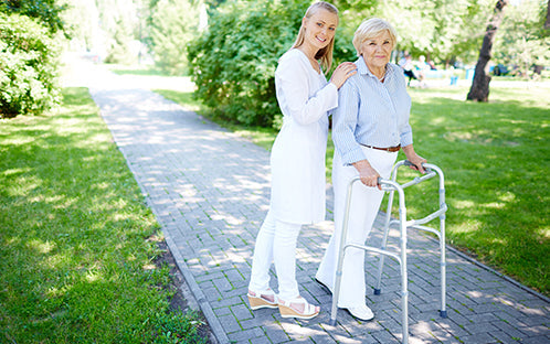 caregiver and senior with rollator