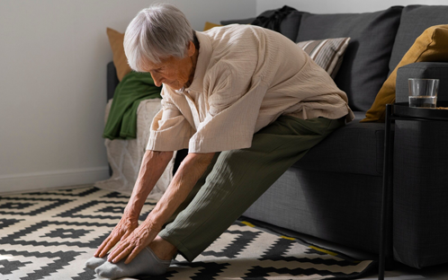 Elderly with Neuropathy doing stretching exercises