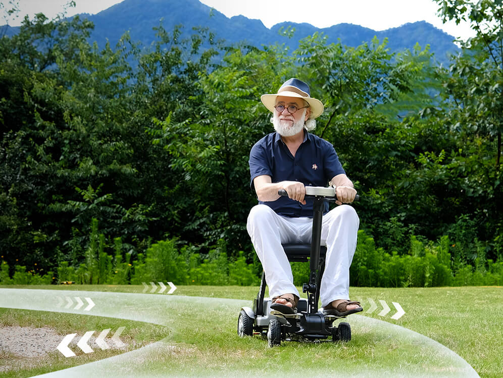 Man driving a mobility scooter outdoors