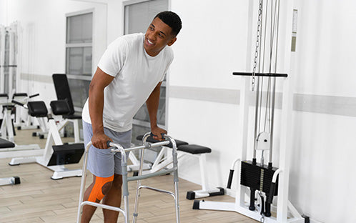 A man in recovery using a walker.