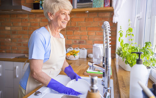 senior is doing the dishes.