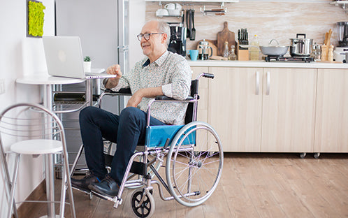 A senior with a chronic illness seated in a wheelchair