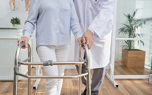 caregiver, patient and rollator