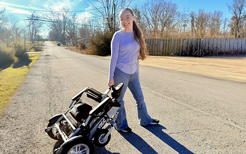  Chronic Illness Girl CoraBeth with Her Giveaways Prize V62 Wheelchair