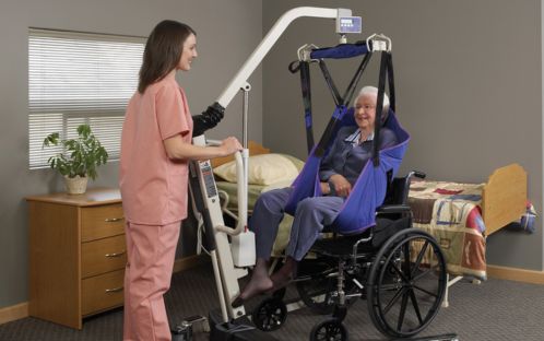 Using a Hoyer lift to transfer the senior.