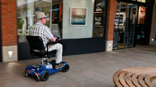 Elderly people driving 4-wheel scooters for shopping